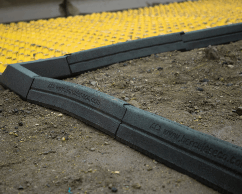 Hercules Eco Blocks curve around soil to form border.