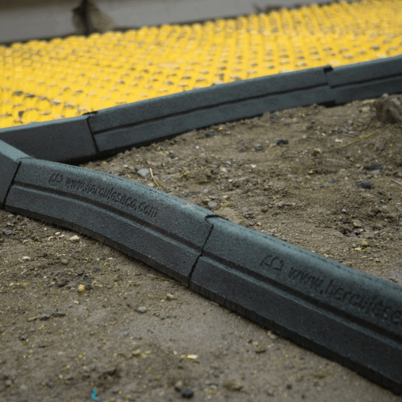 Hercules Eco Blocks curve around soil to form border.