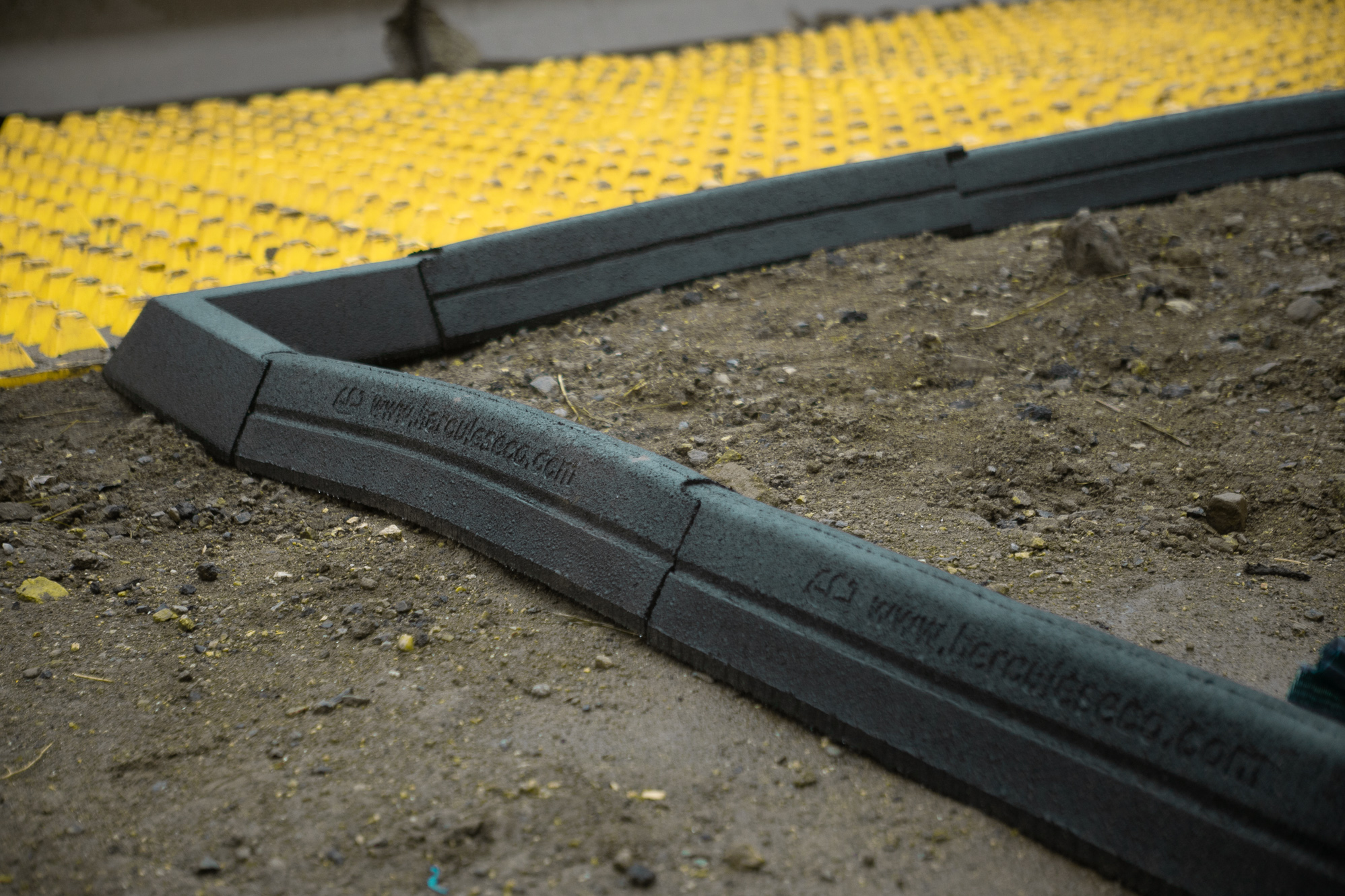 Hercules Eco Blocks curve around soil to form border.