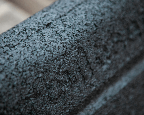 Close-up of Hercules Eco Block; Rough, textured black surface.